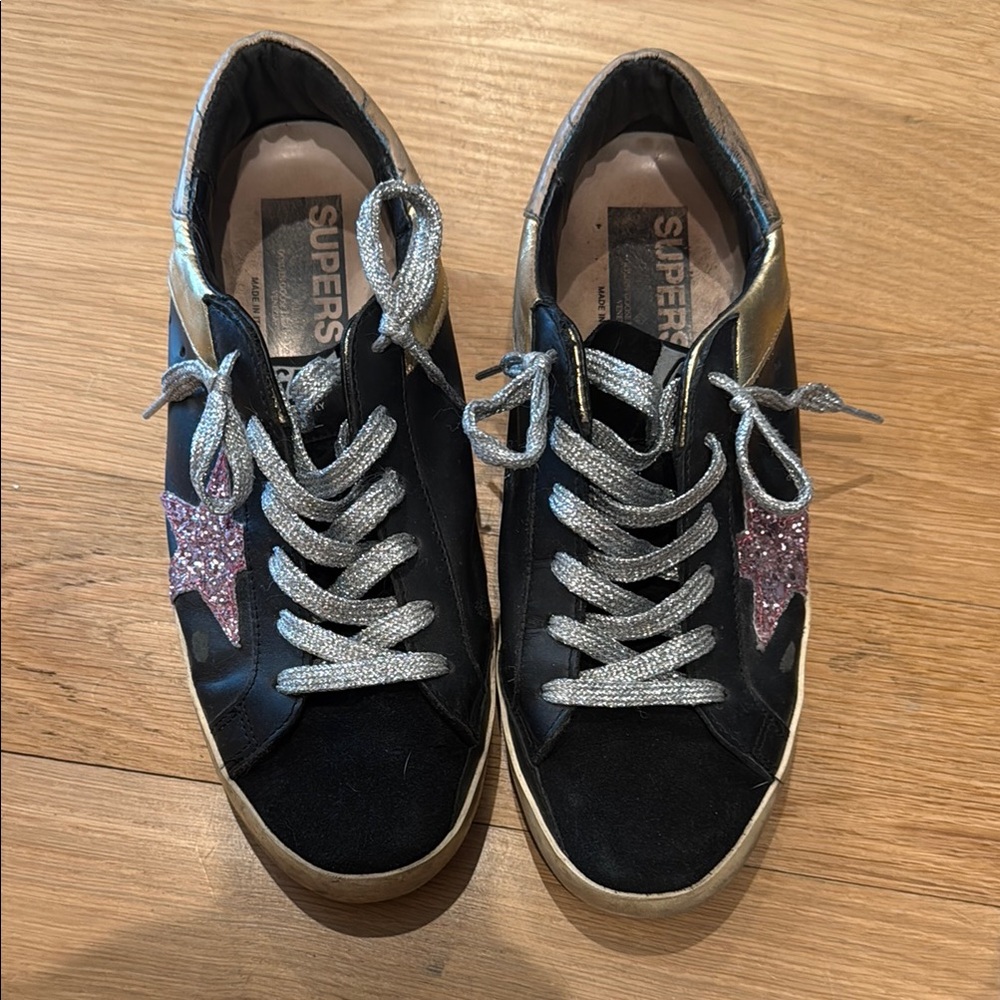 Golden Goose Black and Gold Sneakers with Retro Charm